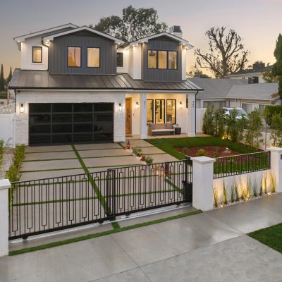 A residence with a boundary and driveway, leading into the yard